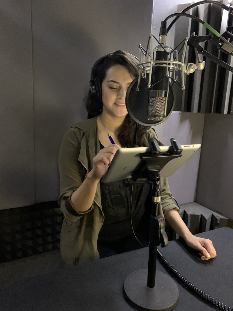 Narrator recording an audiobook at Blacknoise Audio