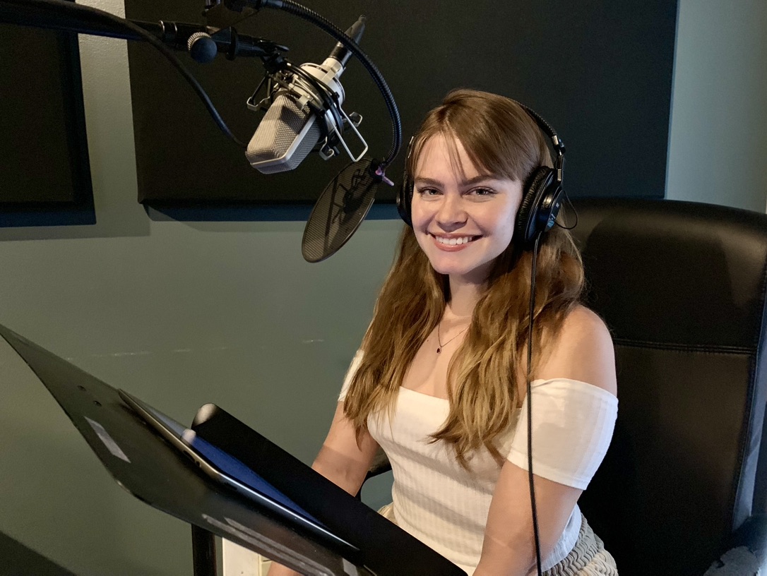Narrator recording in a Blacknoise Audio booth